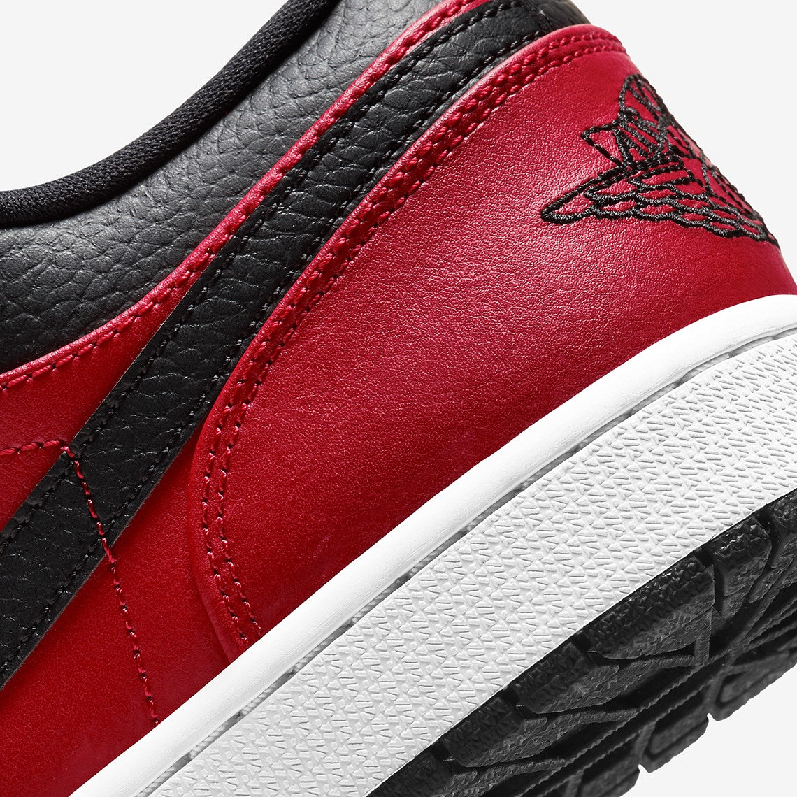 Jordan 1 Low "Reverse Bred Pebbled swoosh"